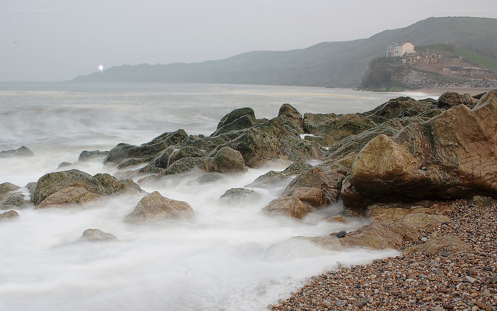 Rocks and waves at coastal cliff