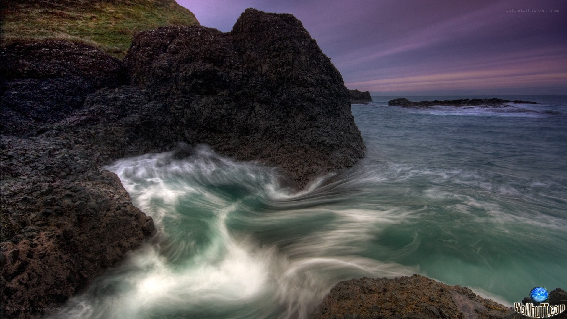 Rocks and waves at dusk