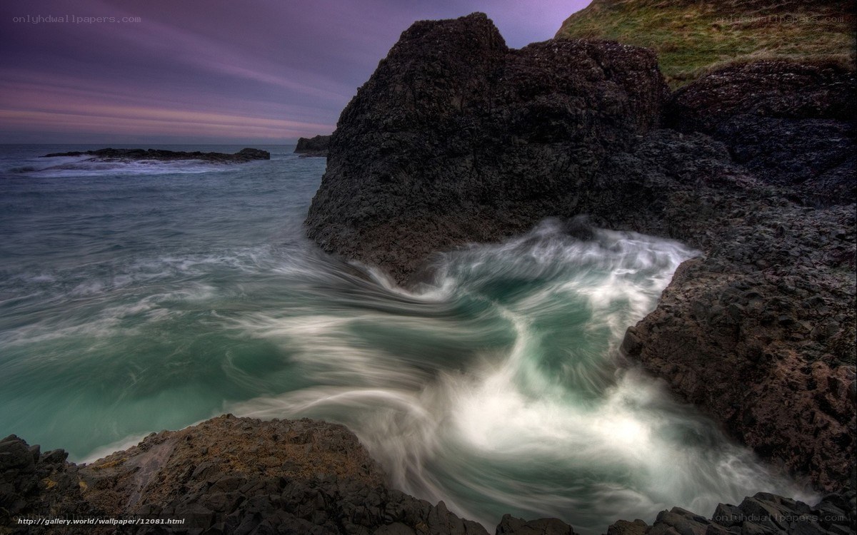 Rocks and waves at dusk