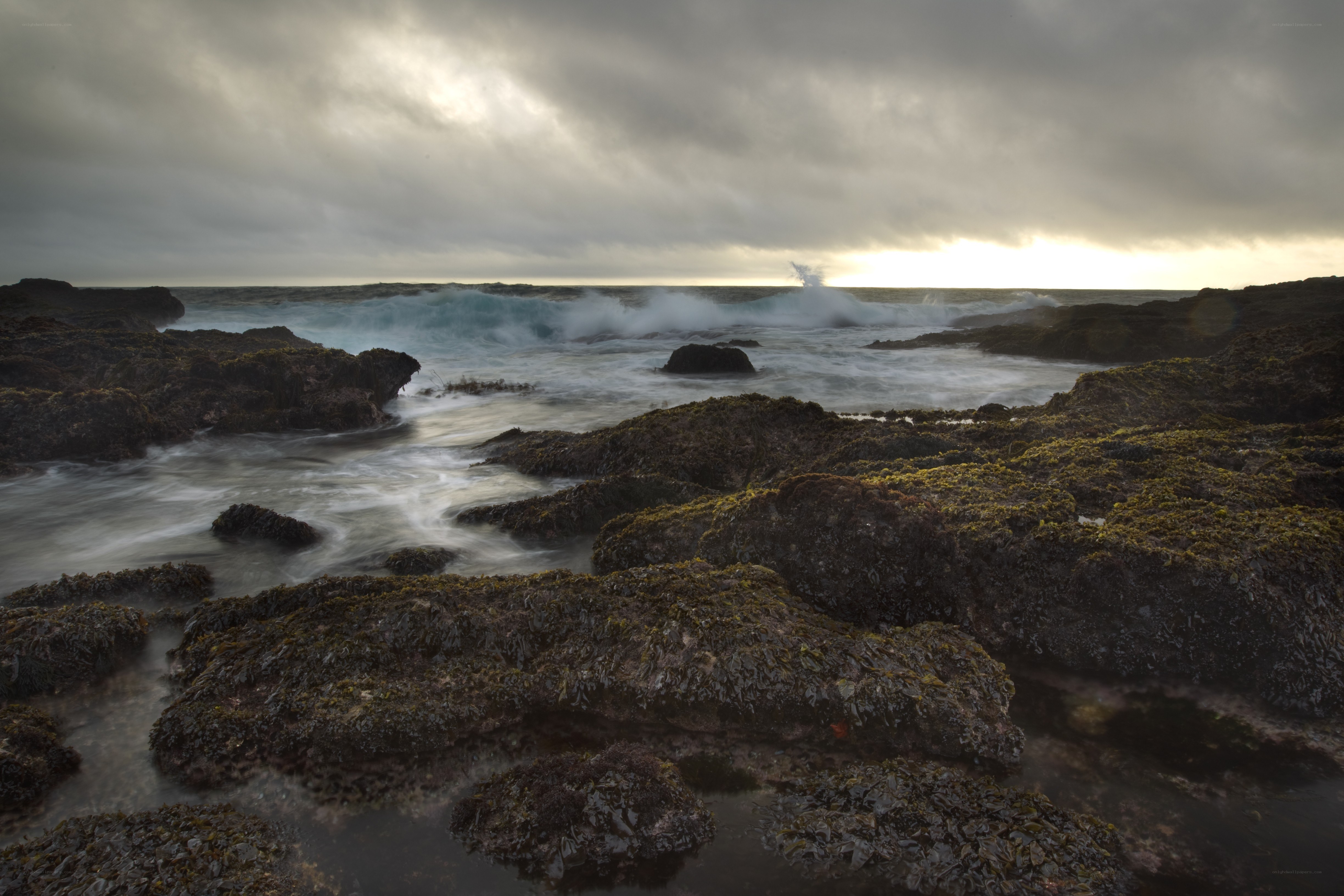 Rocks and waves at sunset