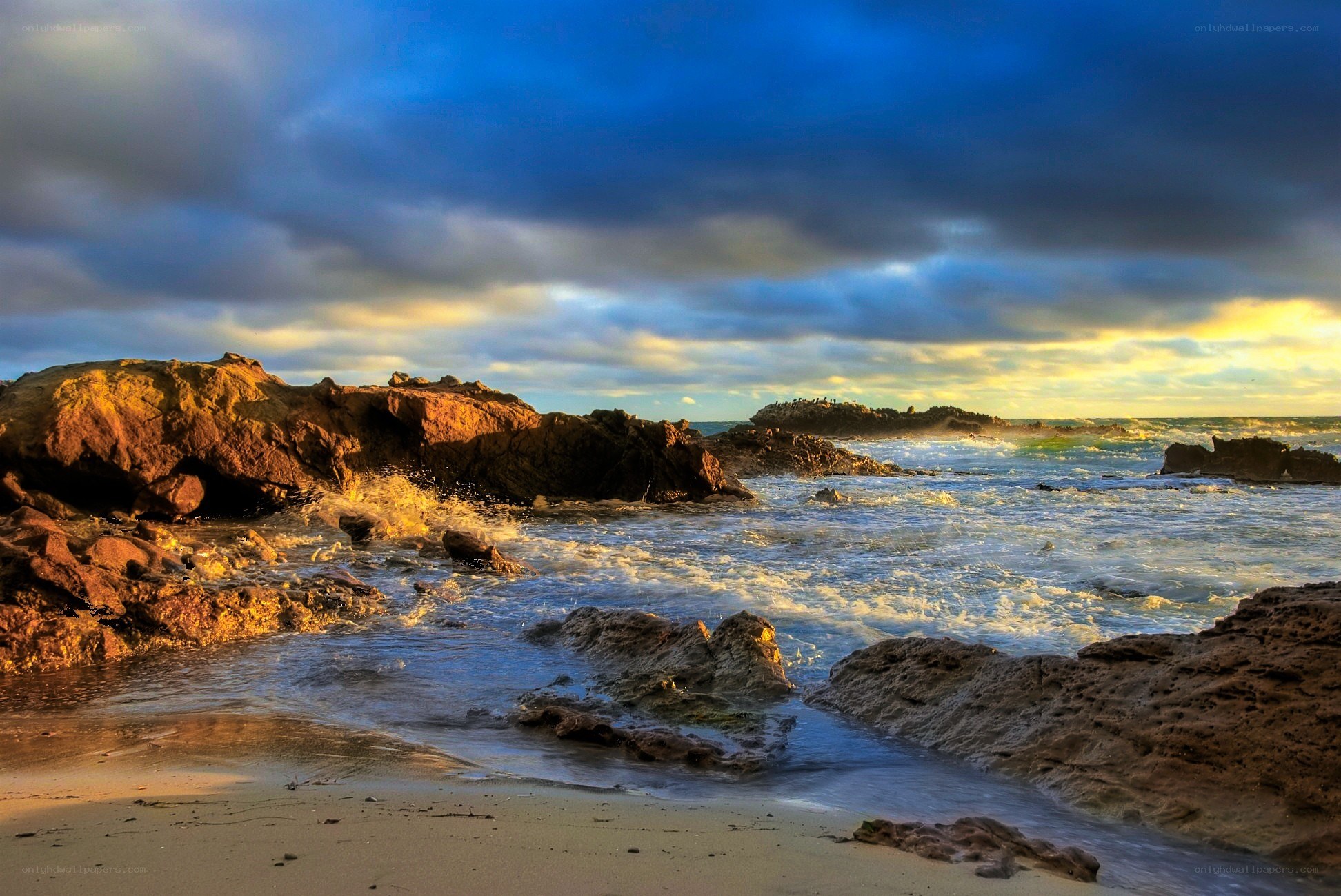 Rocks and waves at sunset