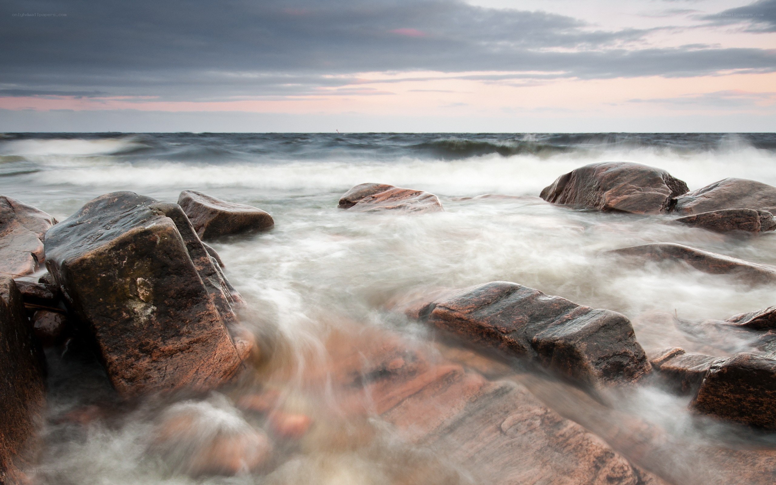 Rocks and waves at sunset