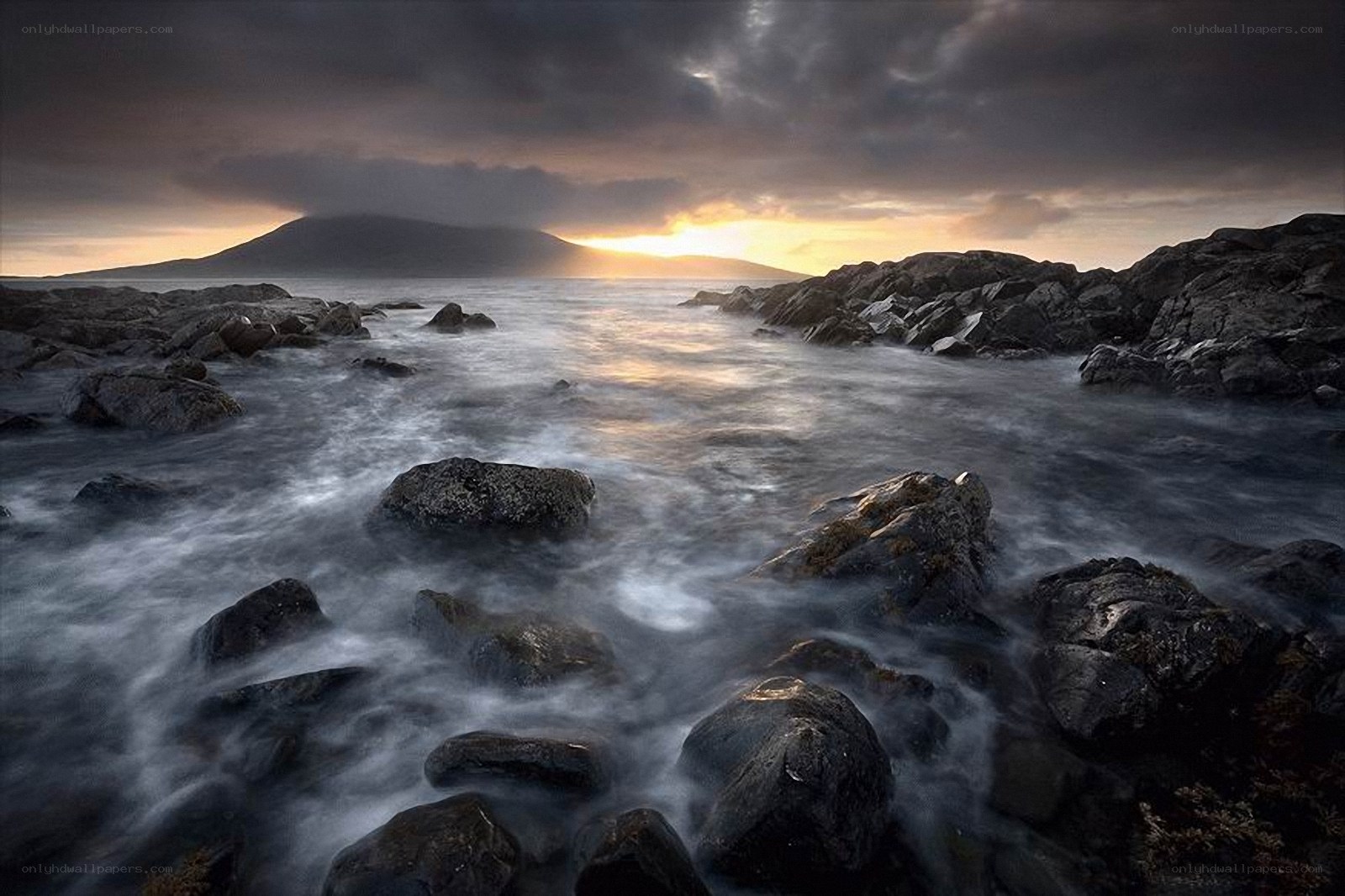 Rocks and waves at sunset