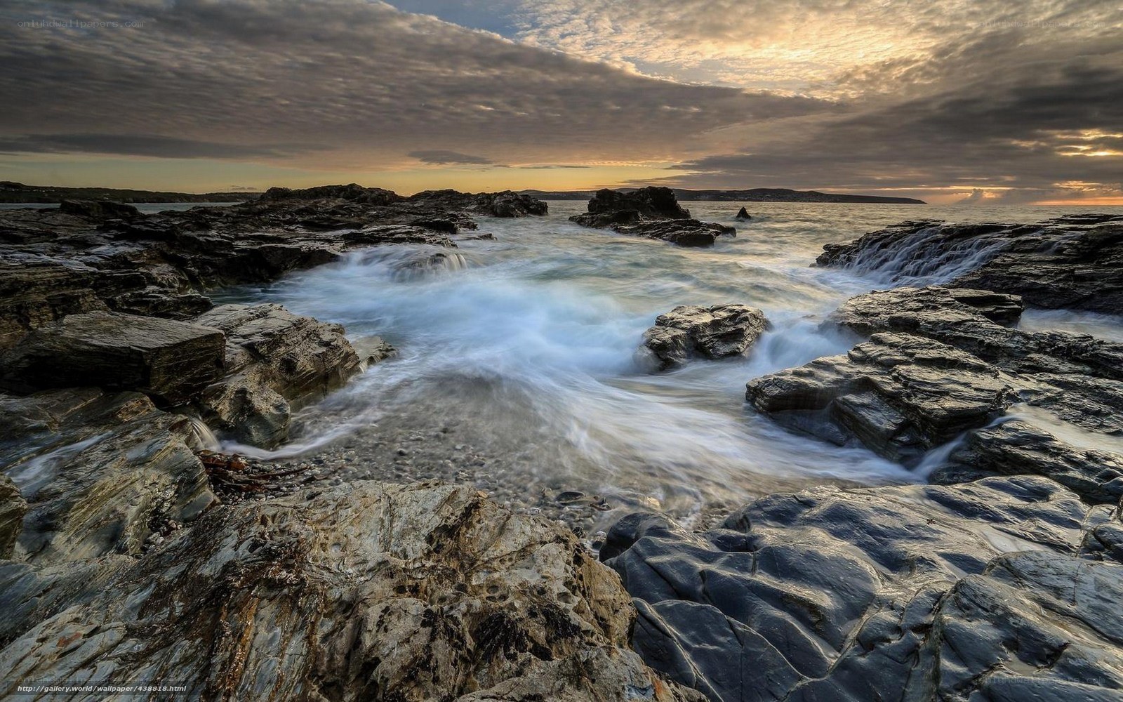 Rocks and waves at sunset