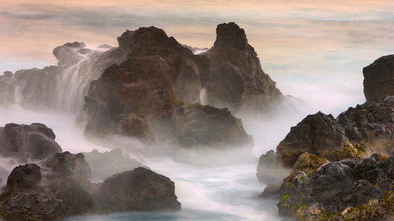 Rocks and waves at sunset