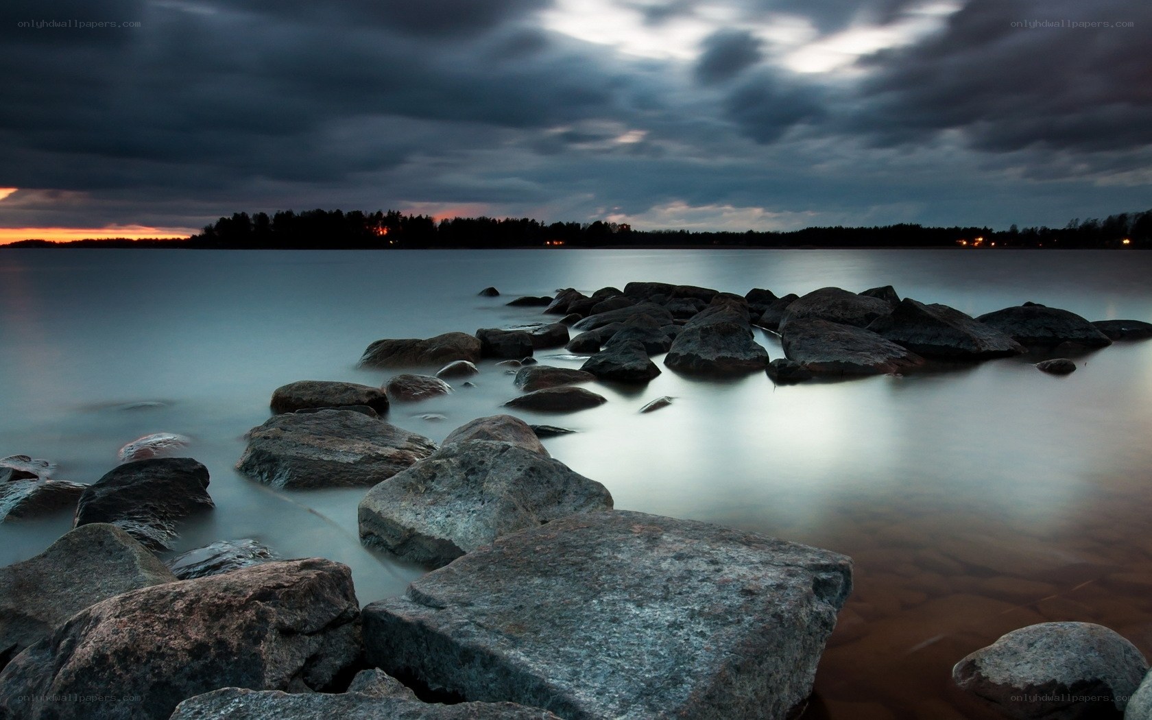 Rocks at dusk by the water