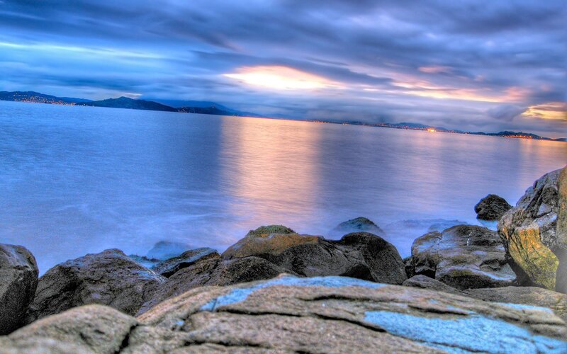 Rocks at Ocean Shoreline — Blue, Dramatic, Sunset, Photograph, Mountains