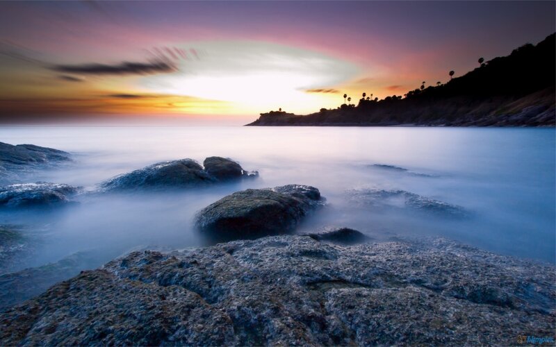Rocks at Ocean Shoreline — Blue, Serene, Sunset