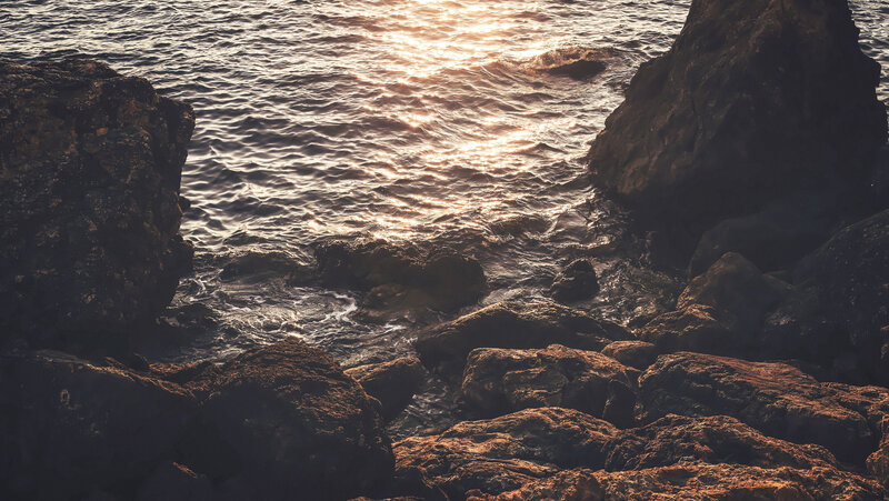 Rocks at Ocean Shoreline — Brown