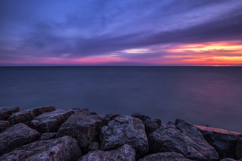 Rocks at Ocean Shoreline — Purple, Serene, Sunset, Photograph
