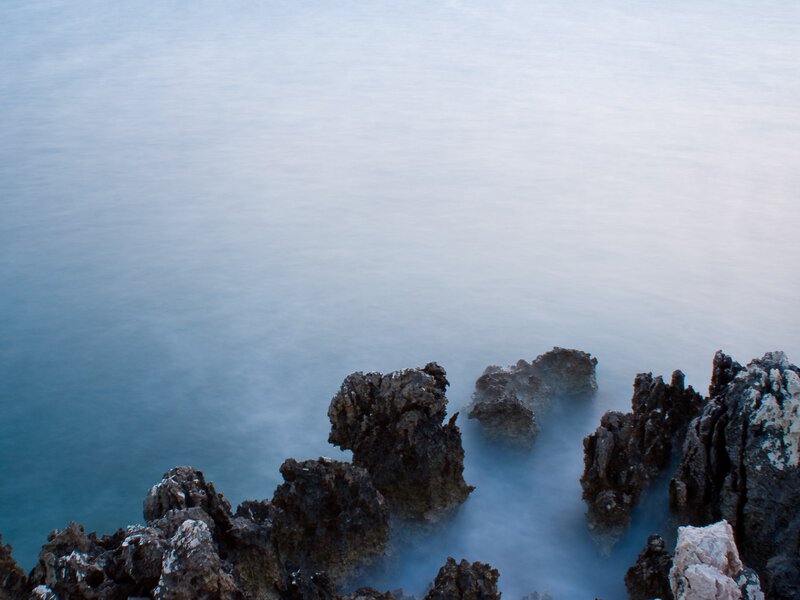 Rocks by the sea at dusk