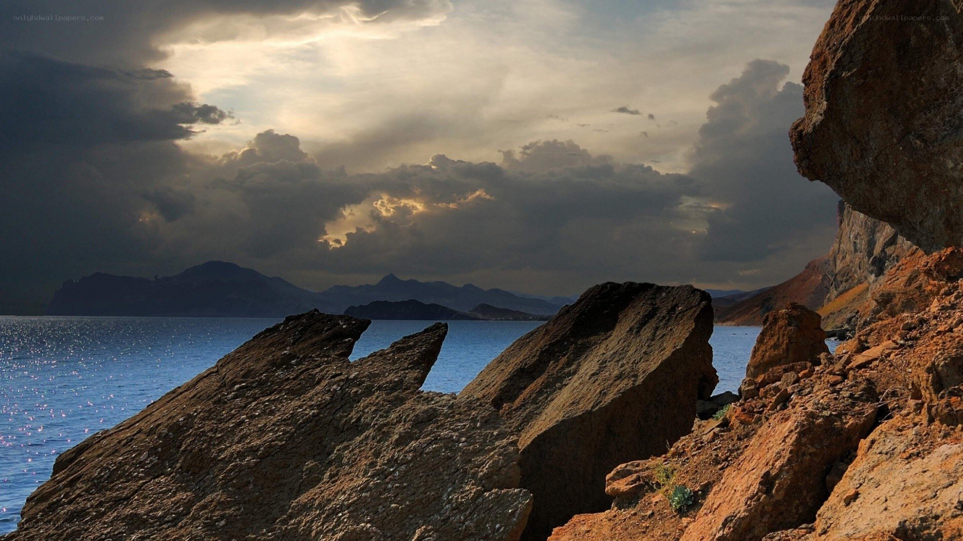 Rocks by the sea at sunset