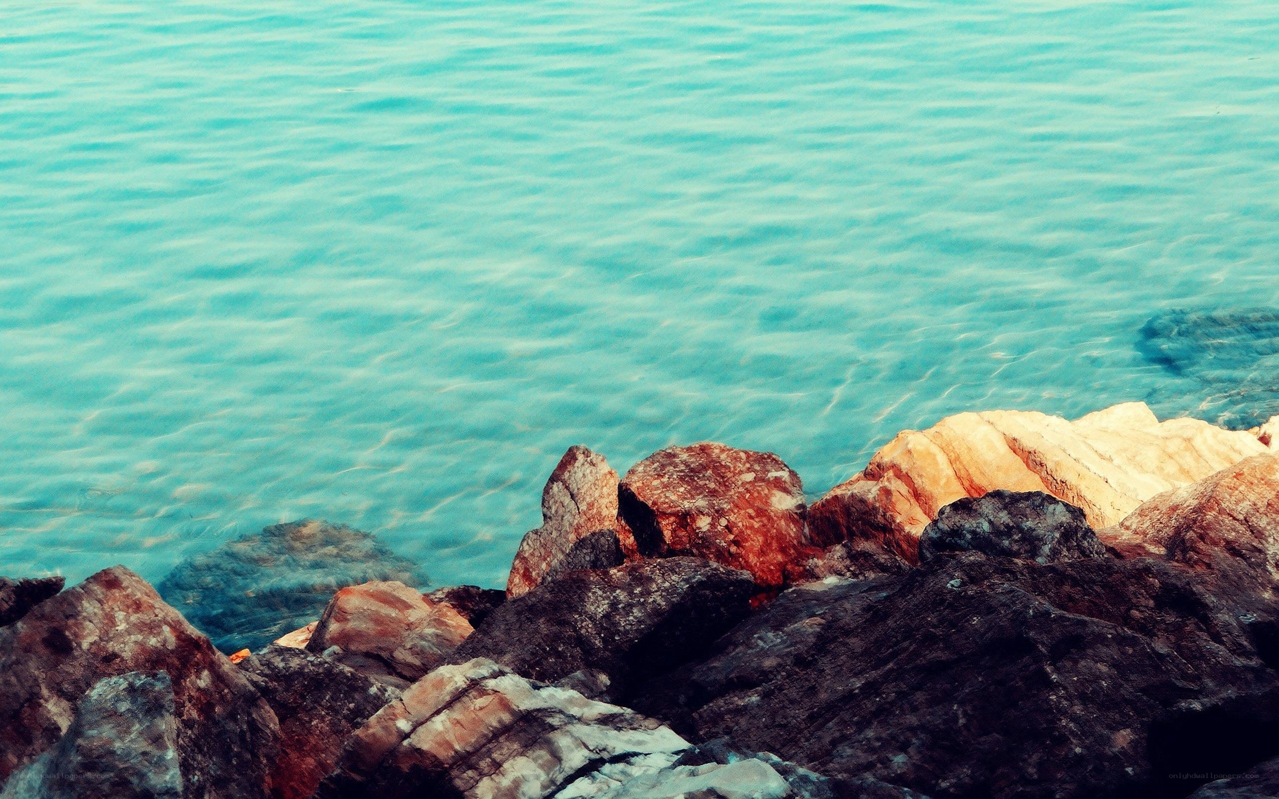 rocks by the turquoise sea