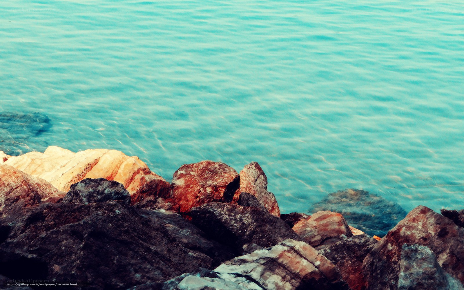 rocks by the turquoise sea