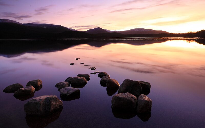 Rocks in Calm Lake — Purple, Serene, Sunset, Photograph, Mountains