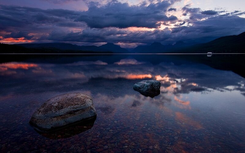 Rocks in Calm Lake — Purple, Serene, Sunset, Photograph