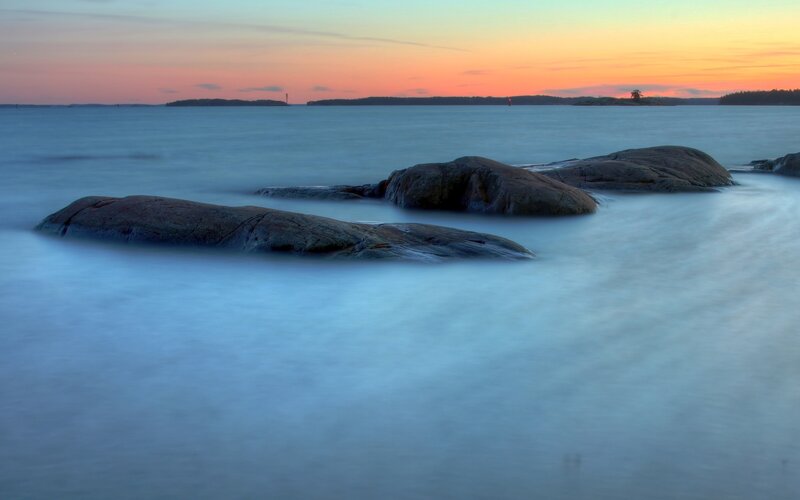 Rocks in Calm Water — Blue, Serene, Sunset, Photograph, Islands