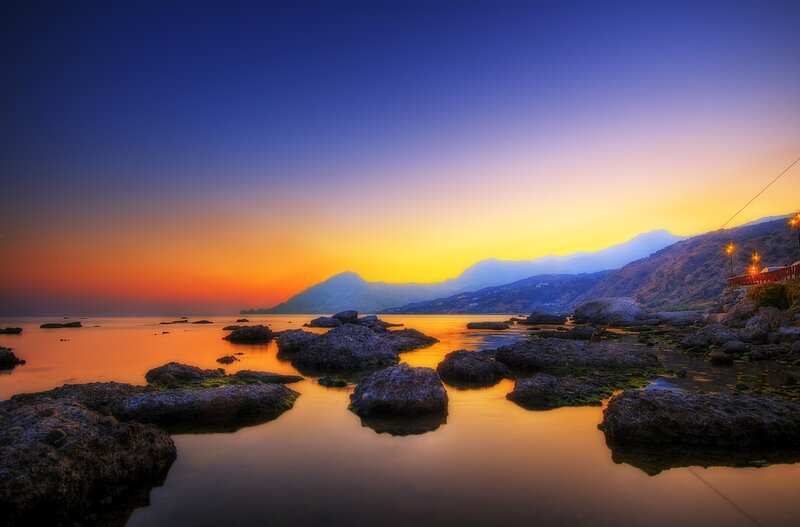 Rocks in Calm Water — Blue, Serene, Sunset, Photograph, Mountains