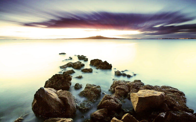 Rocks in Calm Water — Blue, Serene, Sunset, Photograph, Sea, Sky, Clouds