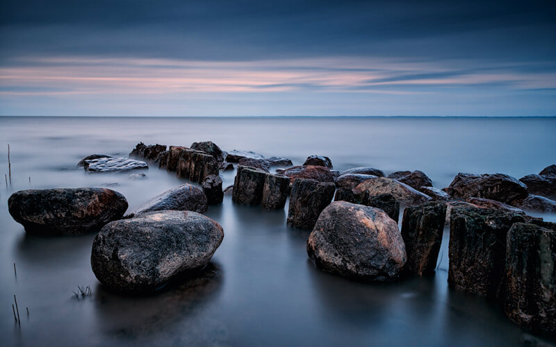 Rocks in Calm Water — Blue, Serene, Sunset, Photograph, Sea, Sky