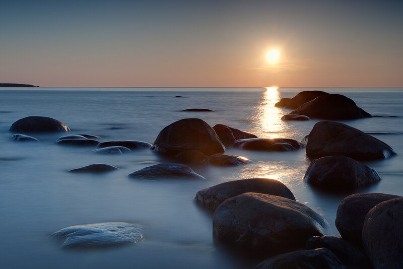 Rocks in Calm Water — Blue, Serene, Sunset
