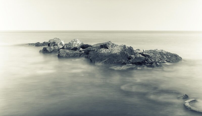 Rocks in Calm Water — Gray, Serene, Photograph