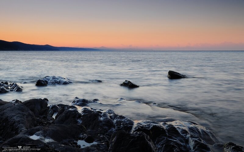 Rocks in Calm Water — Orange, Serene, Sunset, Photograph, Sea