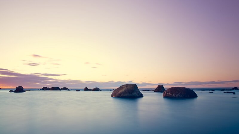 Rocks in Calm Water — Purple, Serene, Sunset, Photograph, Sky, Clouds, Ocean