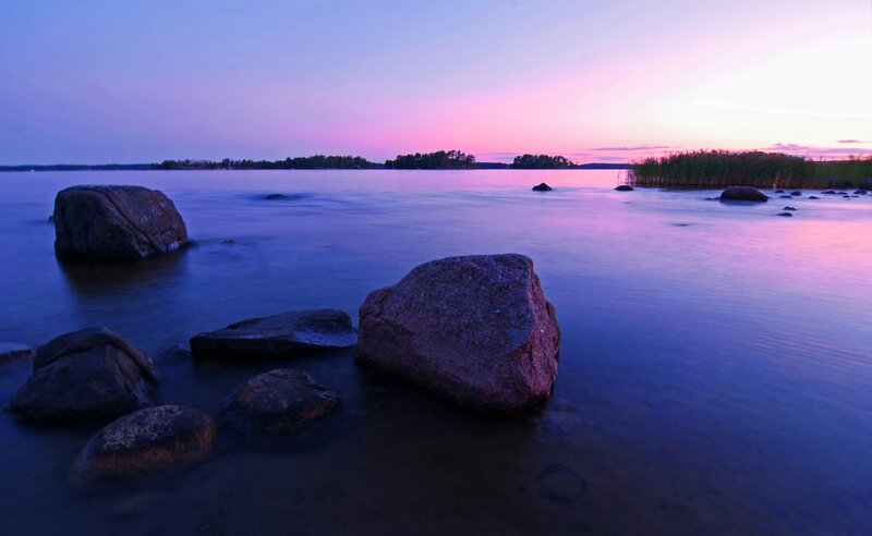 Rocks in Calm Water — Purple, Serene, Sunset, Photograph, Sky, Trees