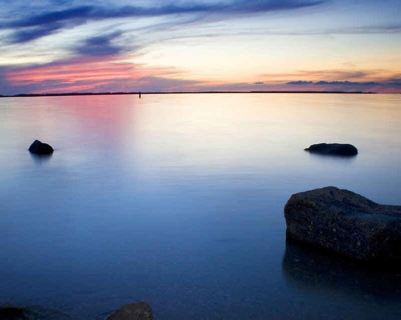 Rocks in Calm Water — Sunset