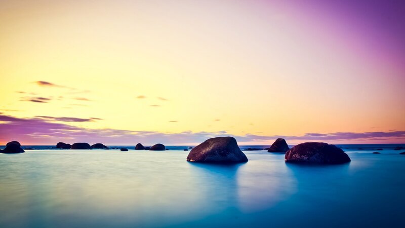 Rocks in Calm Water — Yellow, Serene, Sunset
