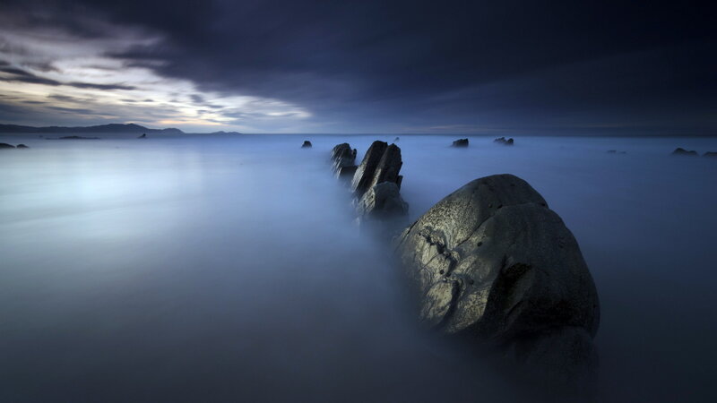 Rocks in Foggy Water