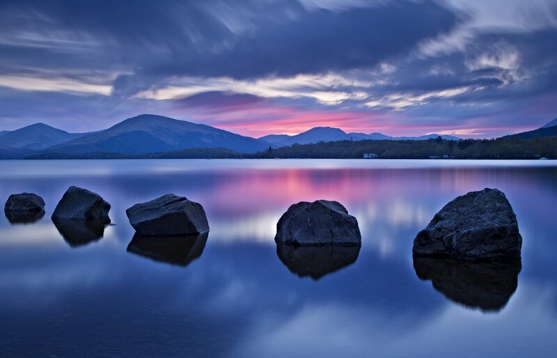 Rocks in Lake at Dusk — Blue, Serene, Sunset, Photograph