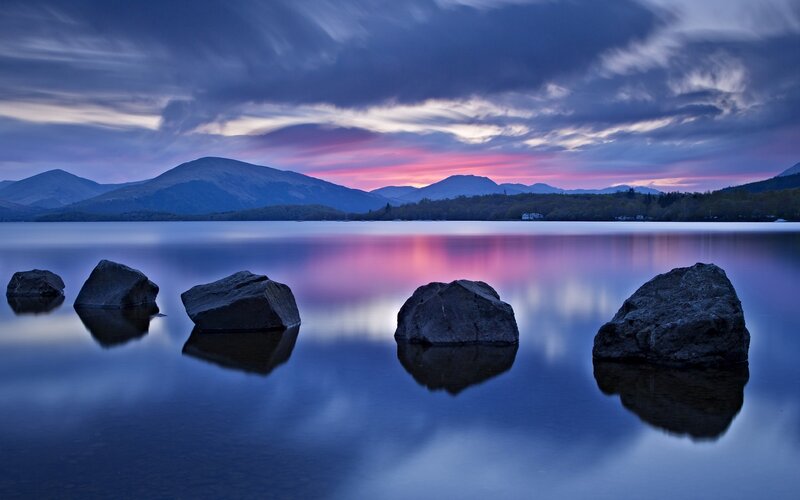 Rocks in Lake at Dusk — Blue, Serene, Sunset