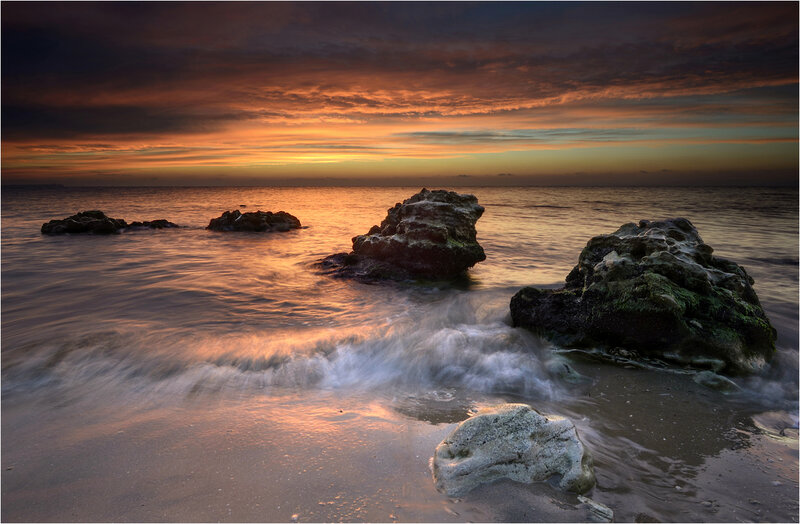 Rocks in Ocean at Sunset — Orange, Dramatic, Photograph, Sky