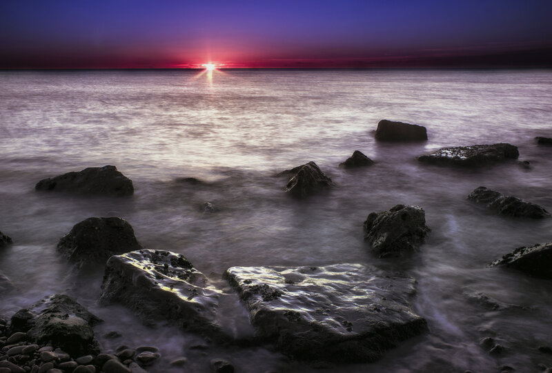 Rocks in Ocean at Sunset — Purple, Serene, Photograph, Sky