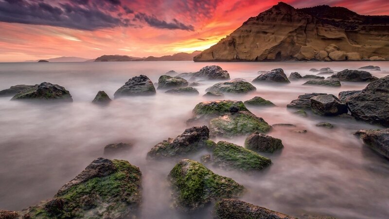 Rocks in Ocean at Sunset — Red, Dramatic, Photograph