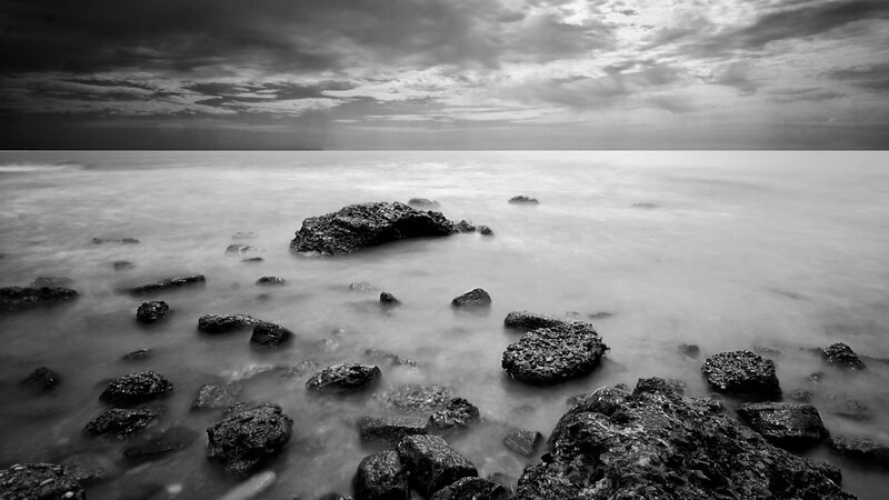 Rocks in Ocean Water — Black, Dramatic