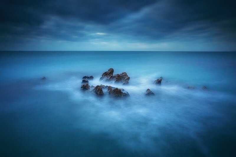 Rocks in Ocean Water — Blue, Dramatic, Photograph