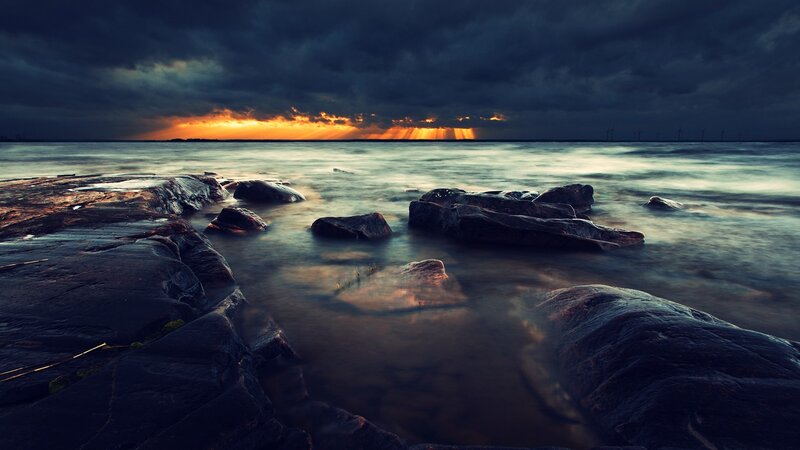 Rocks in Ocean Water — Dark Blue