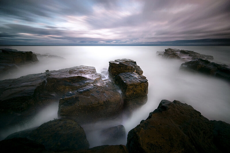 Rocks in Ocean Water — Gray, Dramatic, Night, Photograph
