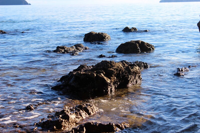 Rocks in Shallow Water — Blue, Calm, Afternoon