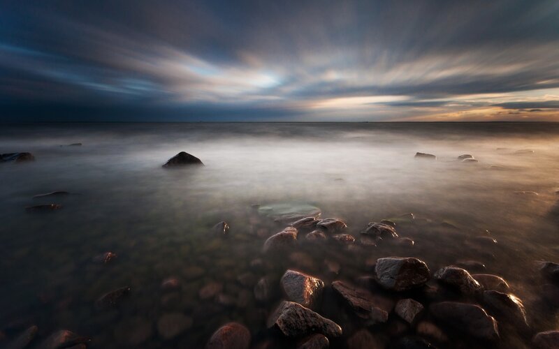 Rocks in Shallow Water — Blue, Serene, Sunset