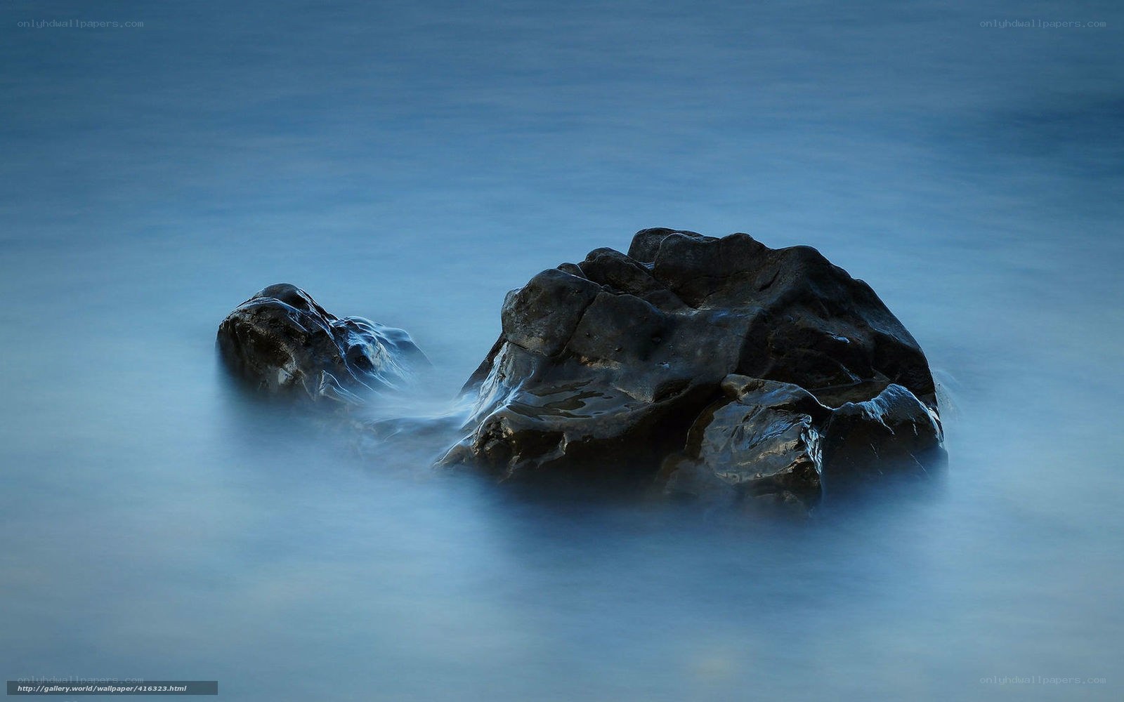 Rocks in the ocean at dusk