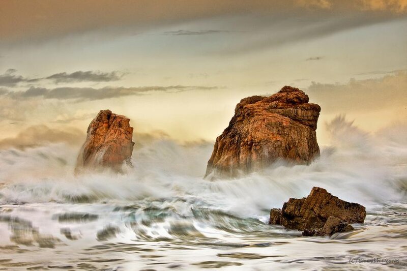 Rocks in the ocean at sunset