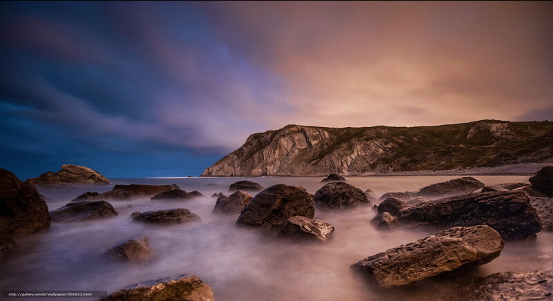 Rocks on a Beach — Blue, Dramatic, Sunset, Photograph, Cliff