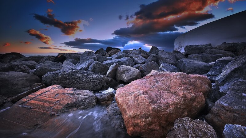 Rocks on a Beach — Blue, Dramatic, Sunset, Photograph, Sky