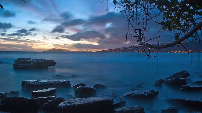 Rocks on a Beach — Blue, Serene, Sunset, Photograph, Trees