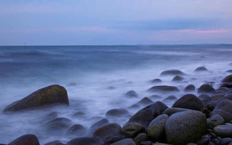 Rocks on a Beach — Blue, Serene, Sunset