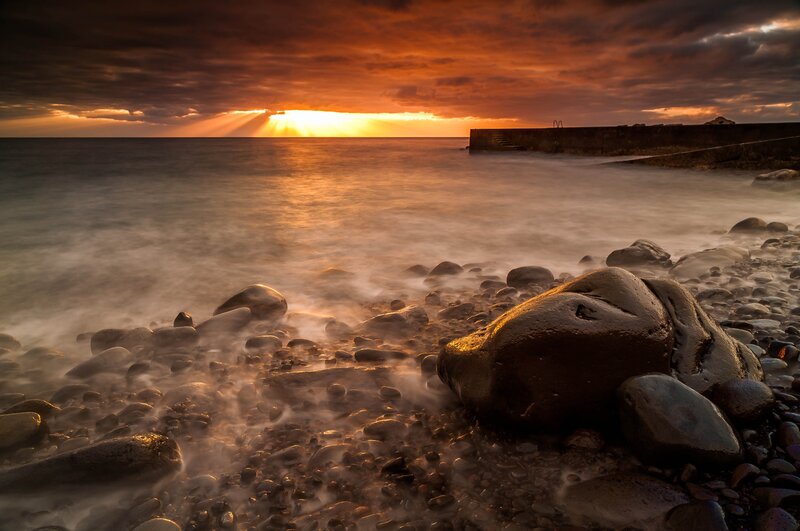 Rocks on a Beach — Orange, Dramatic, Sunrise